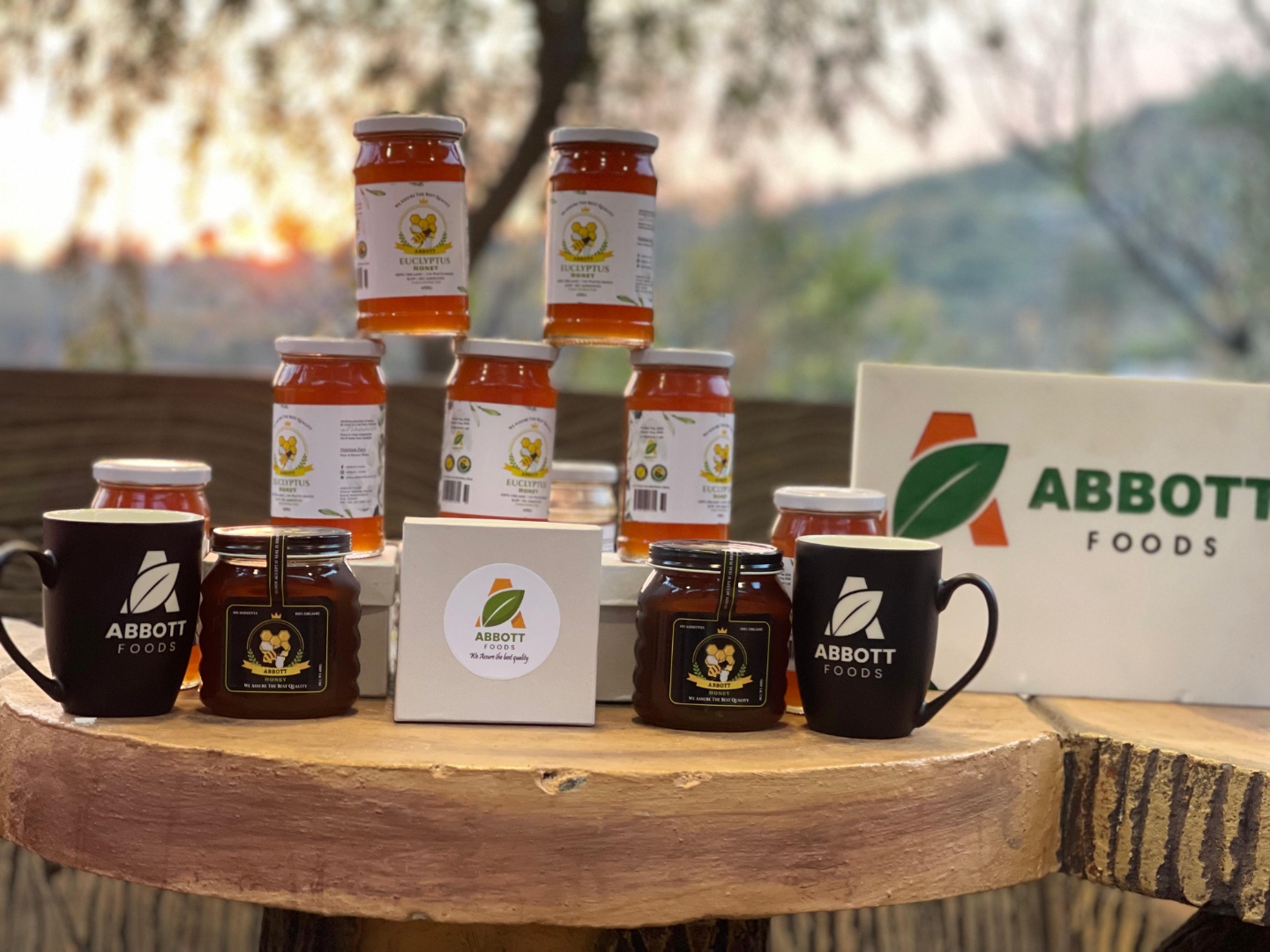 Abbott Foods product lineup — honey jars and mugs